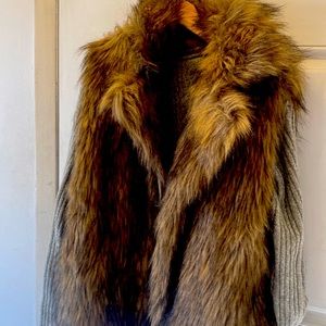 Beautiful faux fur vest. Sexy. Look like a million without harming any animals